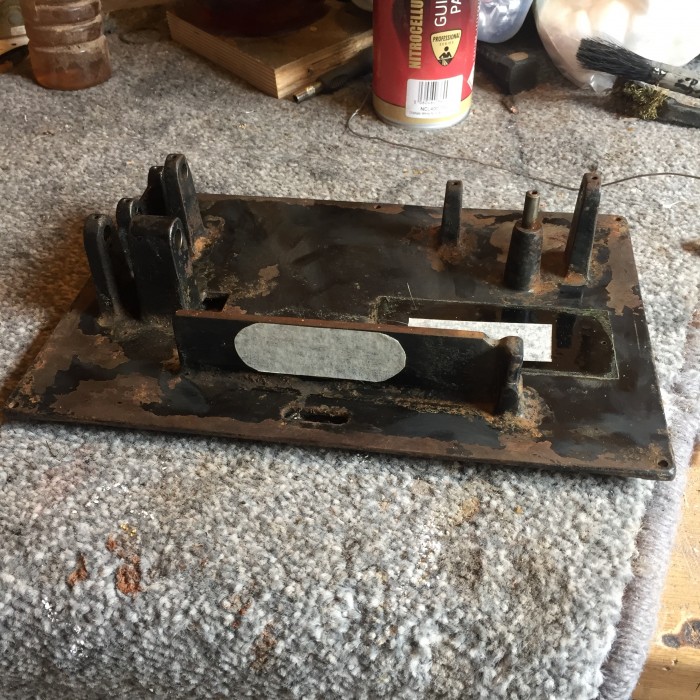 The bed plate after going over with a wire wheel to remove dirt and loose paint, prior to stripping