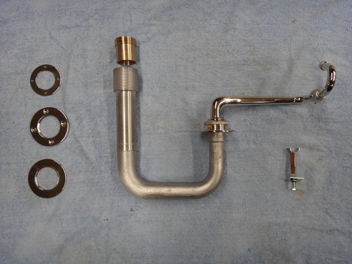 9. The full EMG acoustic system from soundbox to horn inlet spigot. Also shown---tonearm rest and three circular attachments to veneered casing.