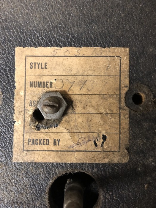 Paper label found on baseboard under platen