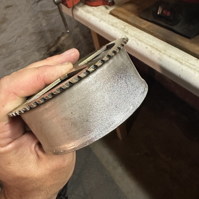 Quick shot of spray paint and sandwiching on the flipped gear to see what it will look like