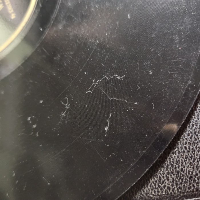 These scratches are mostly cosmetic damage. I noticed no sound while playing.